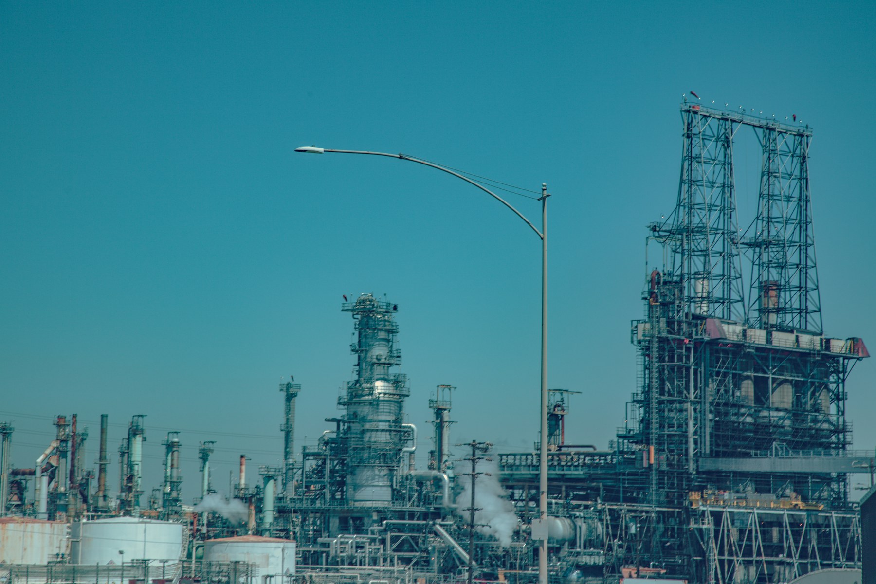 Industrial refinery with process towers and piping